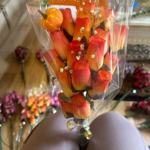 Wooden Roses last forever arranged in a bouquet with rose oil. They smell great.